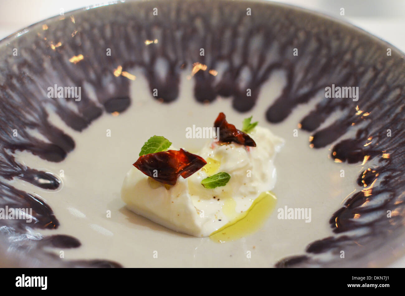A dish of Burrata served at fashionable London restaurant Bubbledogs Stock Photo