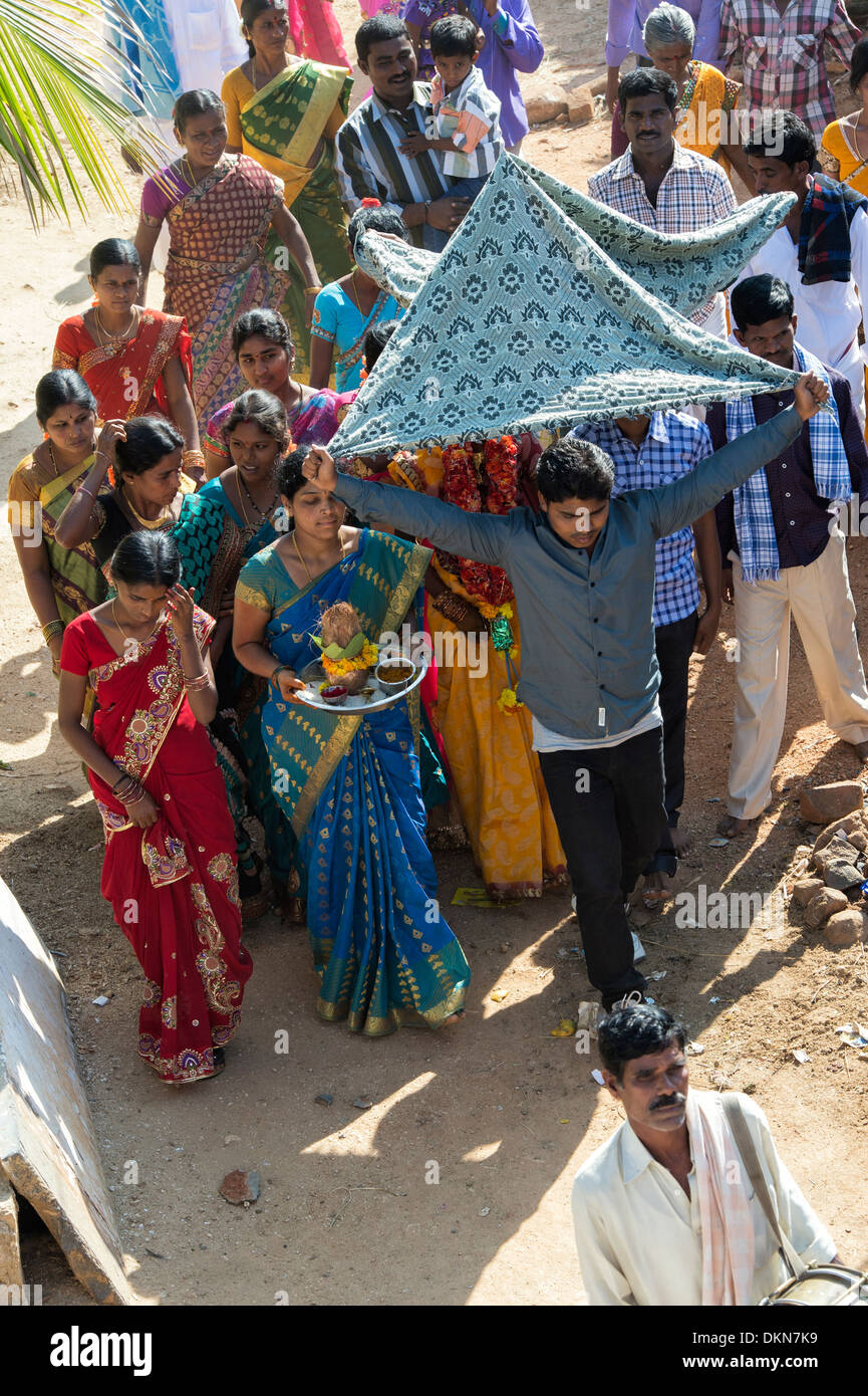 Hindu marriage procession through a rural indian village . Andhra Pradesh, India Stock Photo