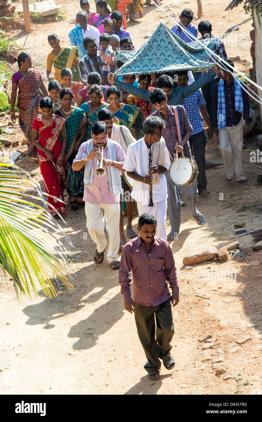 Hindu marriage procession through a rural indian village . Andhra Pradesh, India Stock Photo