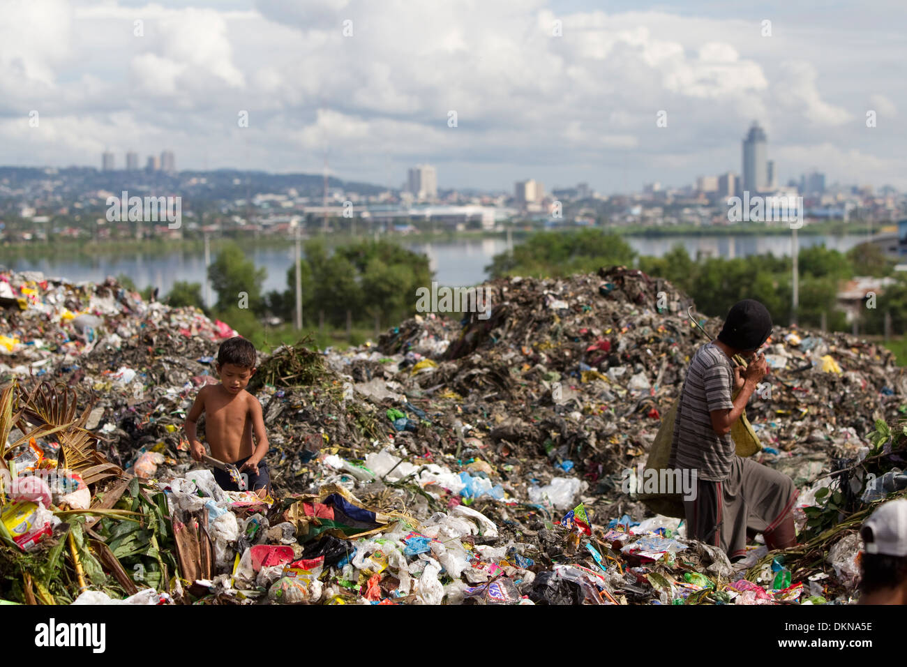 Children scavenging for anything of value within the Inayawan Landfill waste site,Cebu City,Philippines Stock Photo