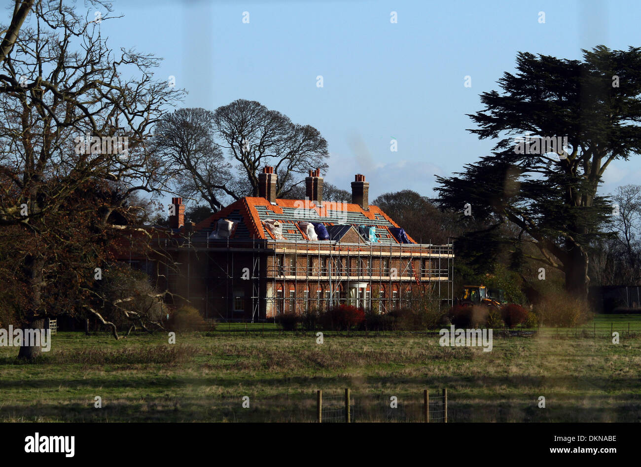 Anmerm Norfolk, UK. 6th Dec 2013. The roof tiles of Anmer Hall are being replaced as renovation and improvement works continue, before The Duke and Duchess of Cambridge move in.  Anmer Hall in Norfolk, is the home given to the Duke and Duchess of Cambridge, Prince William and Kate, as a gift from her Majesty The Queen Elizabeth, to use as a country home for them to share.  Anmer Hall is a late Georgian country house which sits in the grounds of the Sandringham estate and is just two miles east of the Queen's Sandringham House. Credit:  Paul Marriott/Alamy Live News Stock Photo