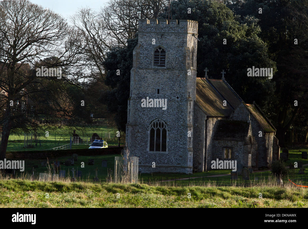 Anmerm Norfolk, UK. 6th Dec 2013. A police car is parked close to St. Mary's Church which is situated just behind Anmer Hall which is undergoing renovation and improvement works, before The Duke and Duchess of Cambridge move in.  Anmer Hall in Norfolk, is the home given to the Duke and Duchess of Cambridge, Prince William and Kate, as a gift from her Majesty The Queen Elizabeth, to use as a country home for them to share.  Anmer Hall is a late Georgian country house which sits in the grounds of the Sandringham estate. Credit:  Paul Marriott/Alamy Live News Stock Photo