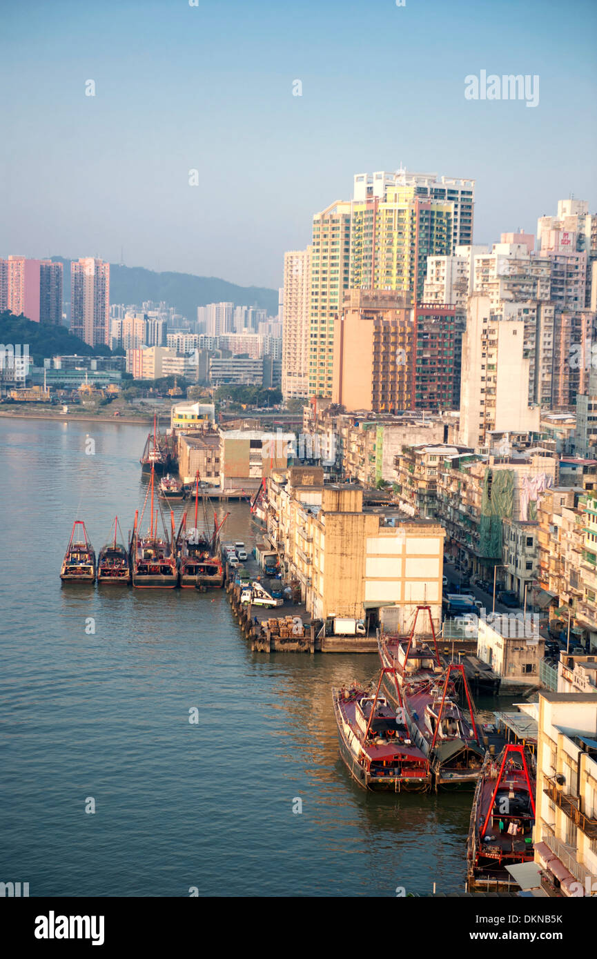 A bird's view of Macau's old inner port with quay buildings and ships plying the waterway of the SAR of China Stock Photo