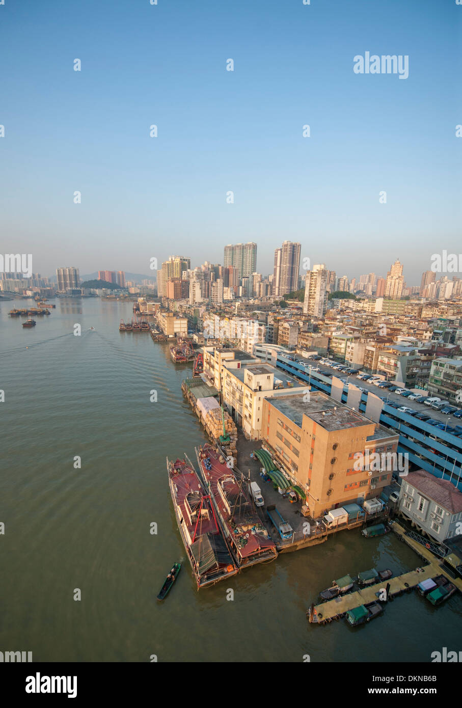 A bird's view of Macau's old inner port with quay buildings and ships plying the waterway of the SAR of China Stock Photo