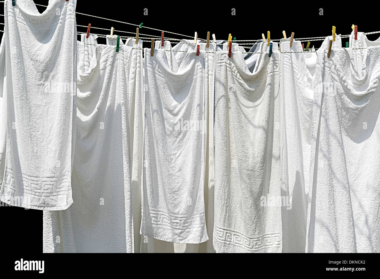 white towels hanging on clothesline isolated on black Stock Photo Alamy