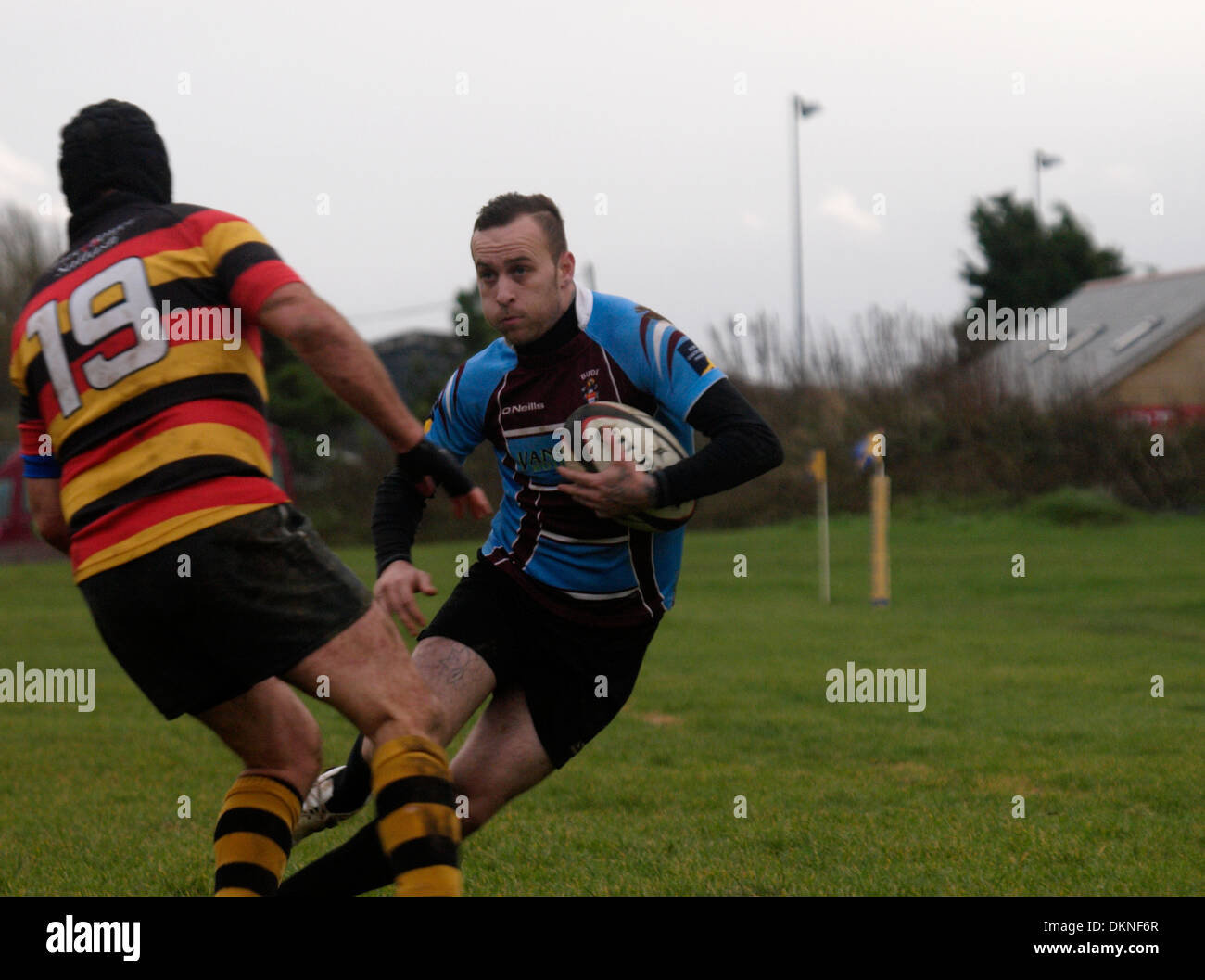Rugby player side stepping opponent, Amateur rugby match, Bude