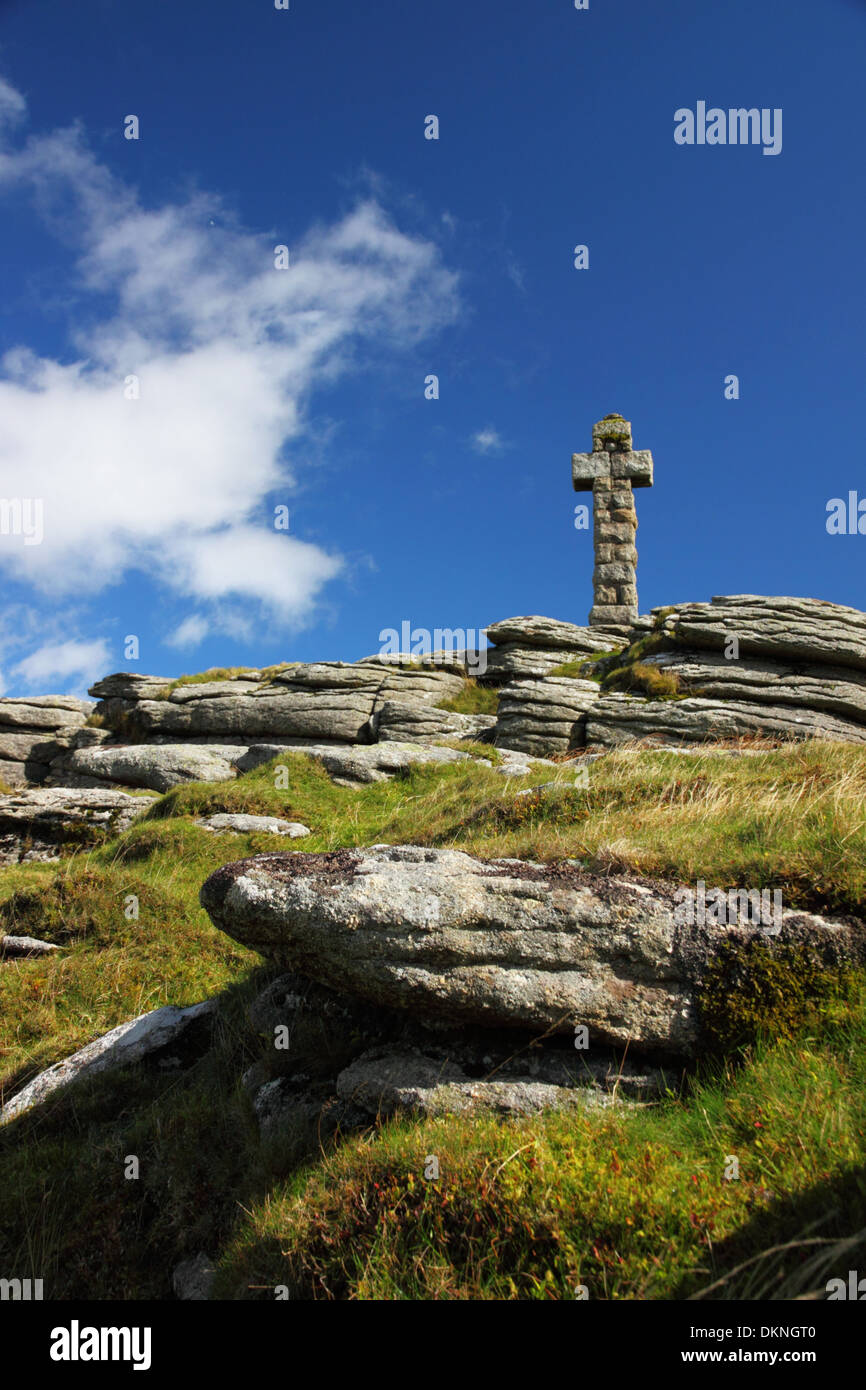 A granite cross atop a granite tor, Dartmoor National Park. Stock Photo