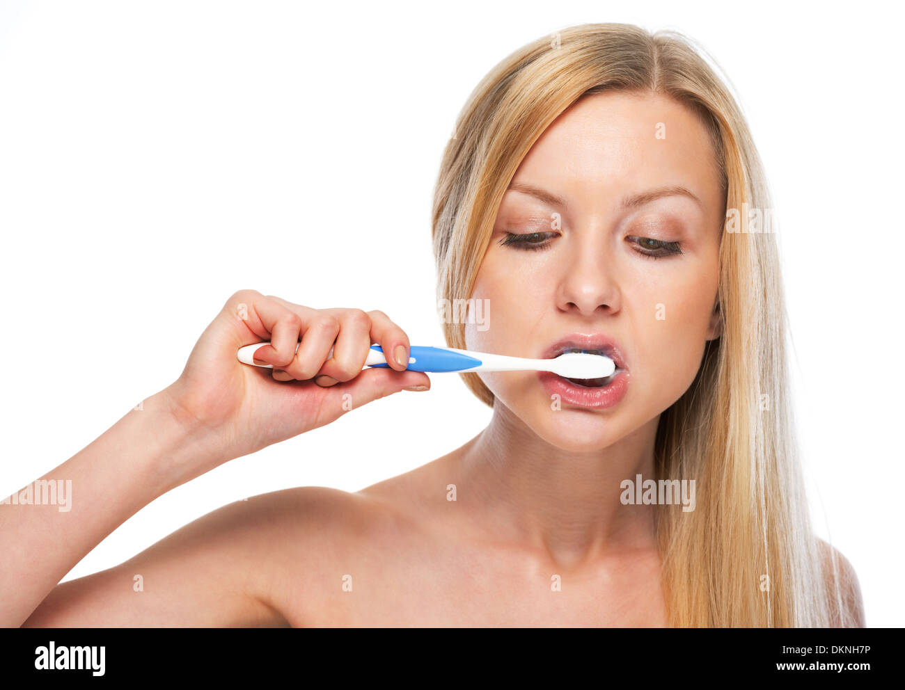 Portrait of teenage girl brushing teeth Stock Photo