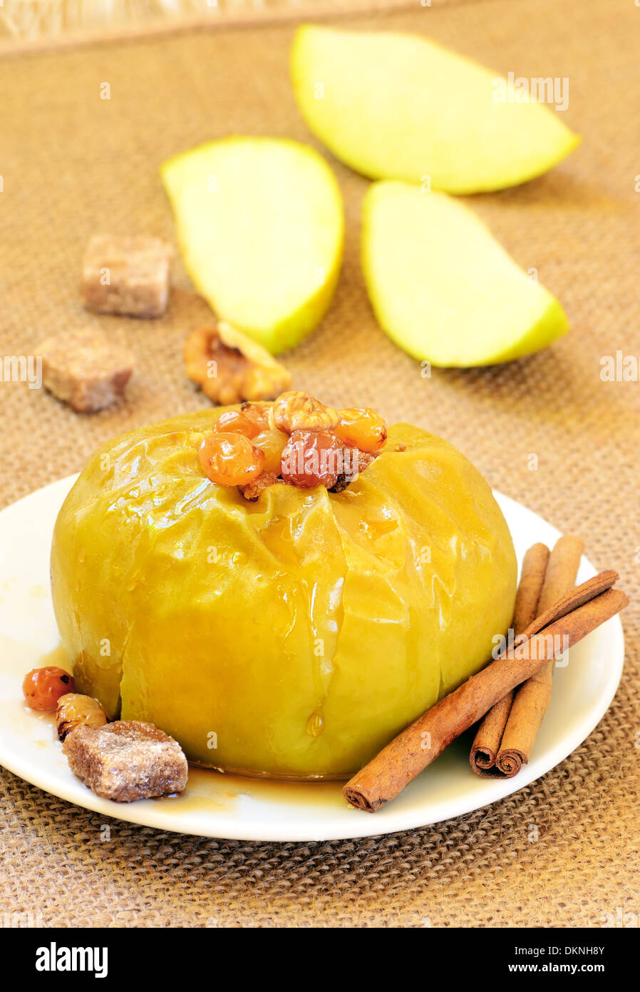 Baked apple with raisins and nuts Stock Photo - Alamy