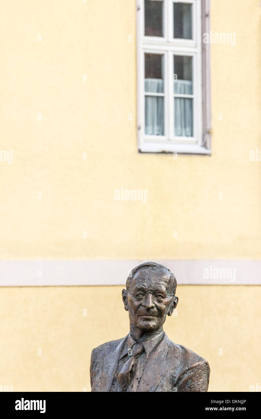 sculpture by kurt tassotti showing writer hermann hesse on the nikolaus bridge in his native town of calw, black forest Stock Photo