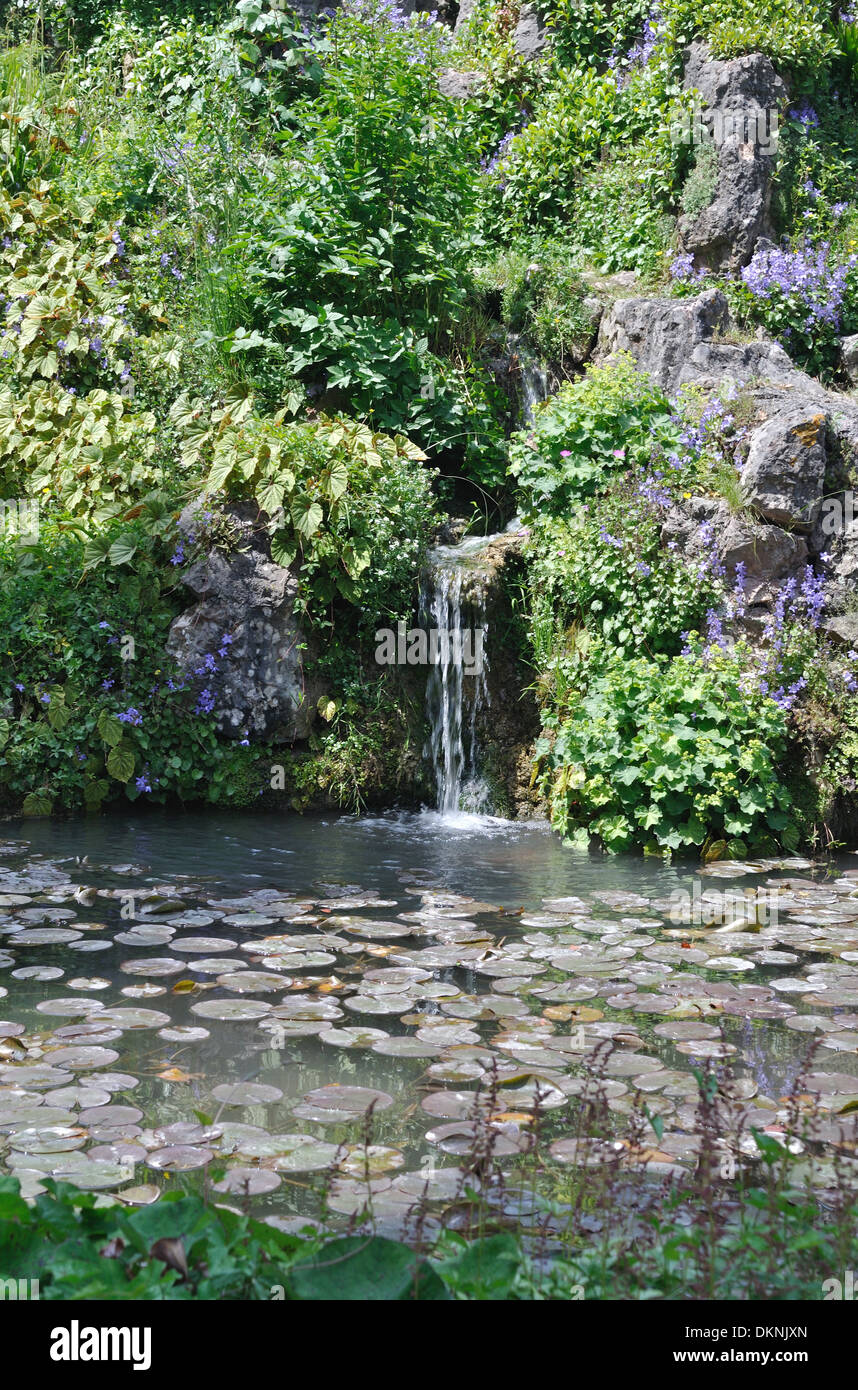 Waterfall and lake in the Andre Heller Botanical Gardens, Gardone Riviera, Lake Garda. Stock Photo