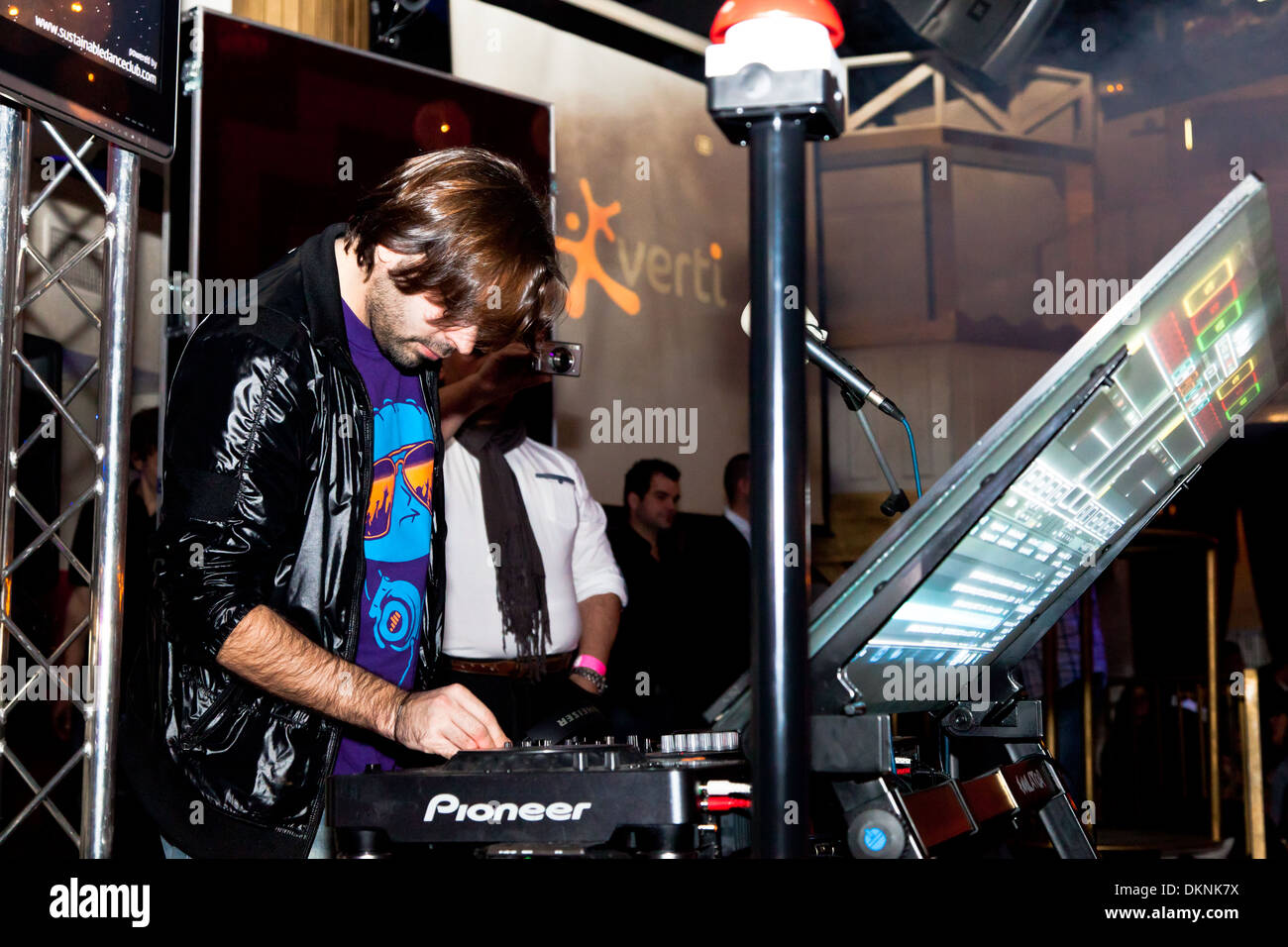 DJ Alvaro Reina next to the mixer to begin the party of the hot mix energy danceflor of the Los 40 Principales Stock Photo