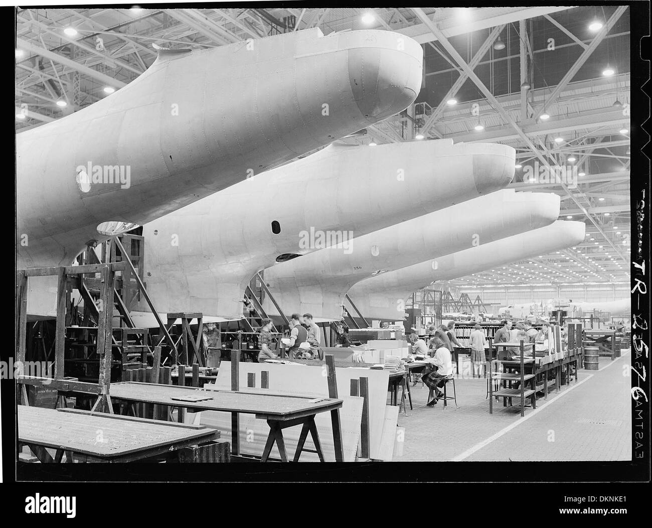 Construction of aircraft at the Glenn L. Martin plant at Baltimore, MD. Fuselages, just out of the assembly jigs are... 520743 Stock Photo