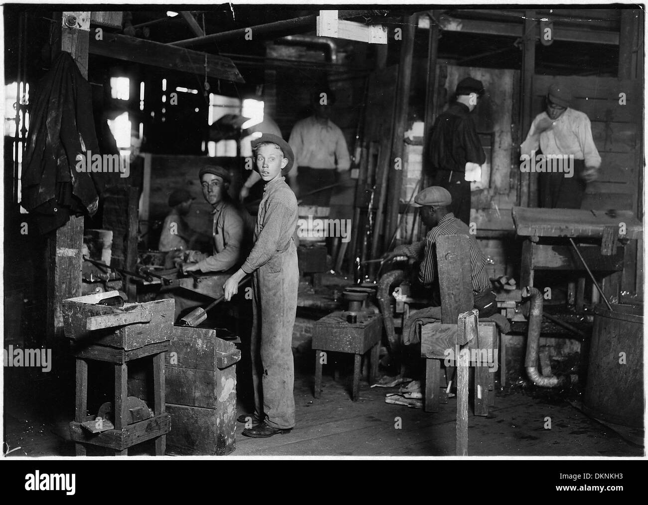 Cumberland Glass Works. A young holding mold boy is seen, dimly, in middle distance to left of centre. Negroes... 523227 Stock Photo