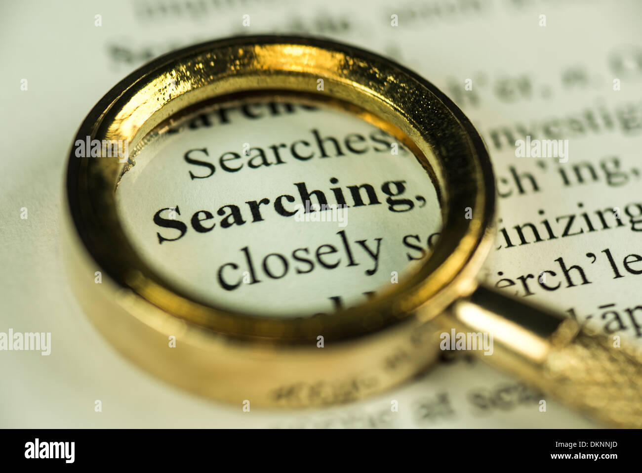 Searching Concept Macro Image Of A Magnifying Glass Over The Word