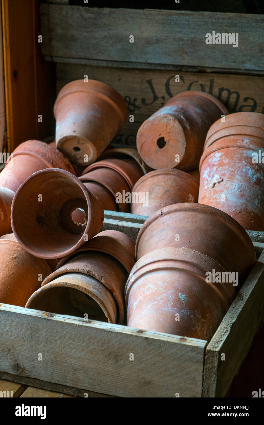 Terracotta pots on the potting bench Stock Photo