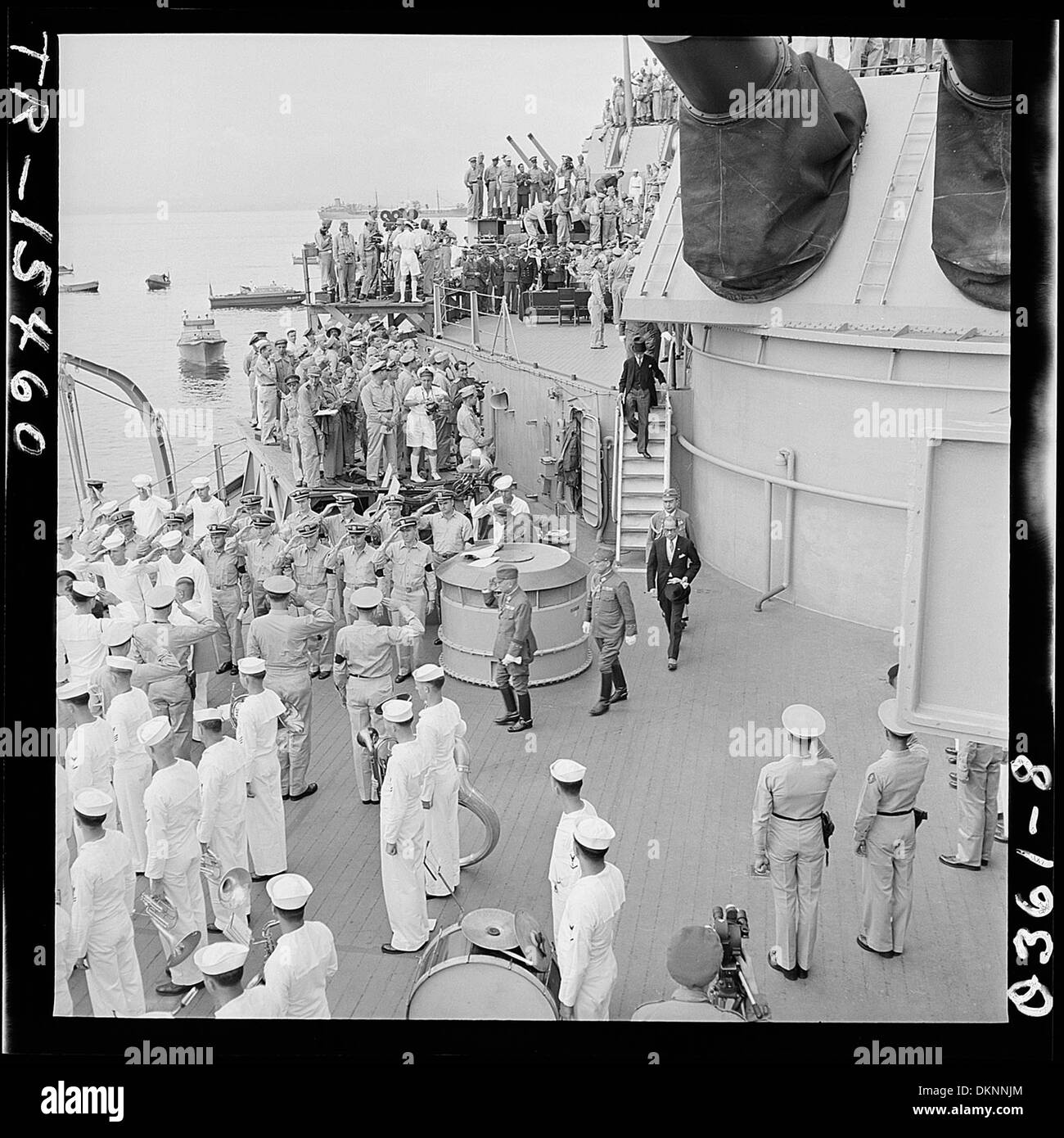 Japanese envoys depart the USS Missouri in Tokyo Bay after signing the formal surrender documents, marking the end of World War II. The event occurred on September 2, 1945, aboard the battleship, which served as the site for Japan's surrender to the Allied forces. Stock Photo