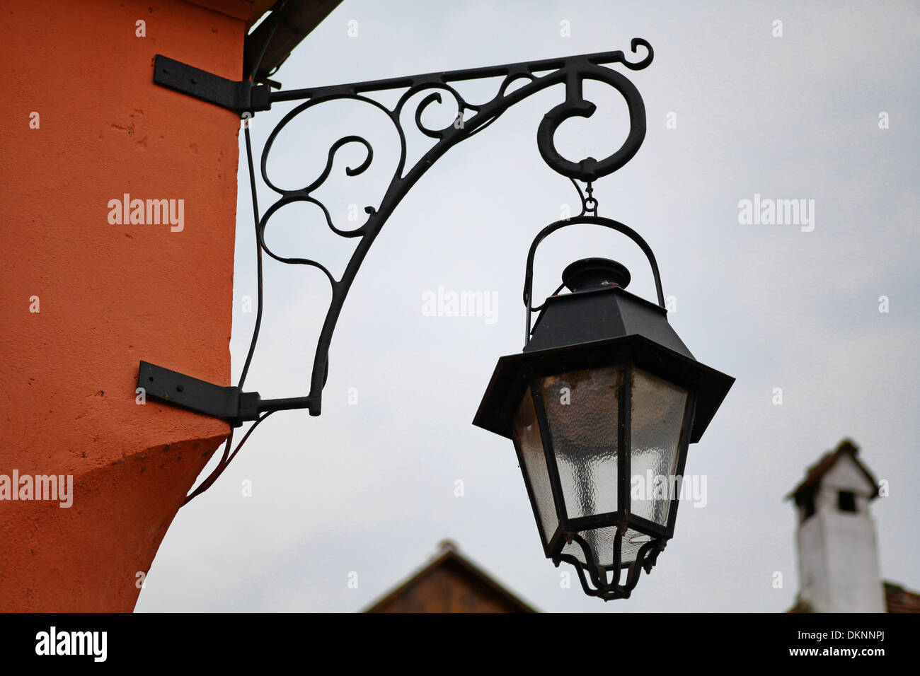 Vintage street lamp hanging on a wall Stock Photo - Alamy