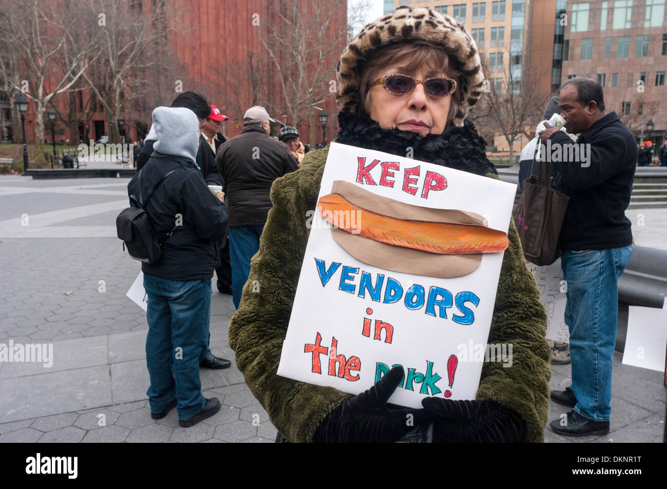New York, NY, USA. 8th Dec, 2013. Greenwich Village resident, Joanna Milazzo, at a rally in Washington Square Park to keep the hot dog vendors in the park. Blogger Cathryn Swan, who writes the WashingtonSquareBlog recently learned the newly formed Washington Square Park Conservancy has asked the NYC Parks Dept not to renew the vendor's contracts, but rather replace them with more upscale and expensive offering. Credit: Stacy Walsh Rosenstock/Alamy Live News Stock Photo