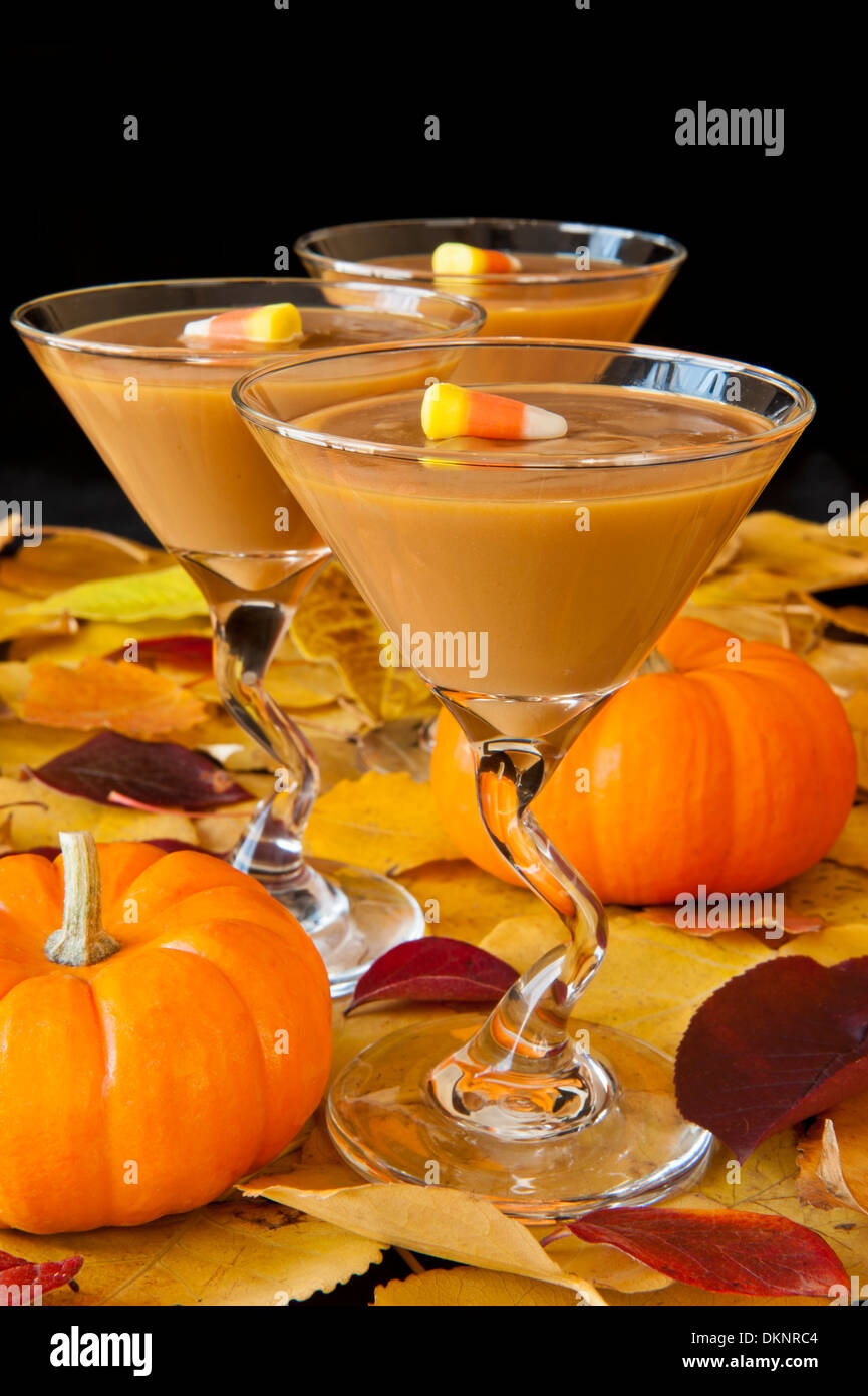 Martini glasses filled with butterscotch pudding decorated with candy