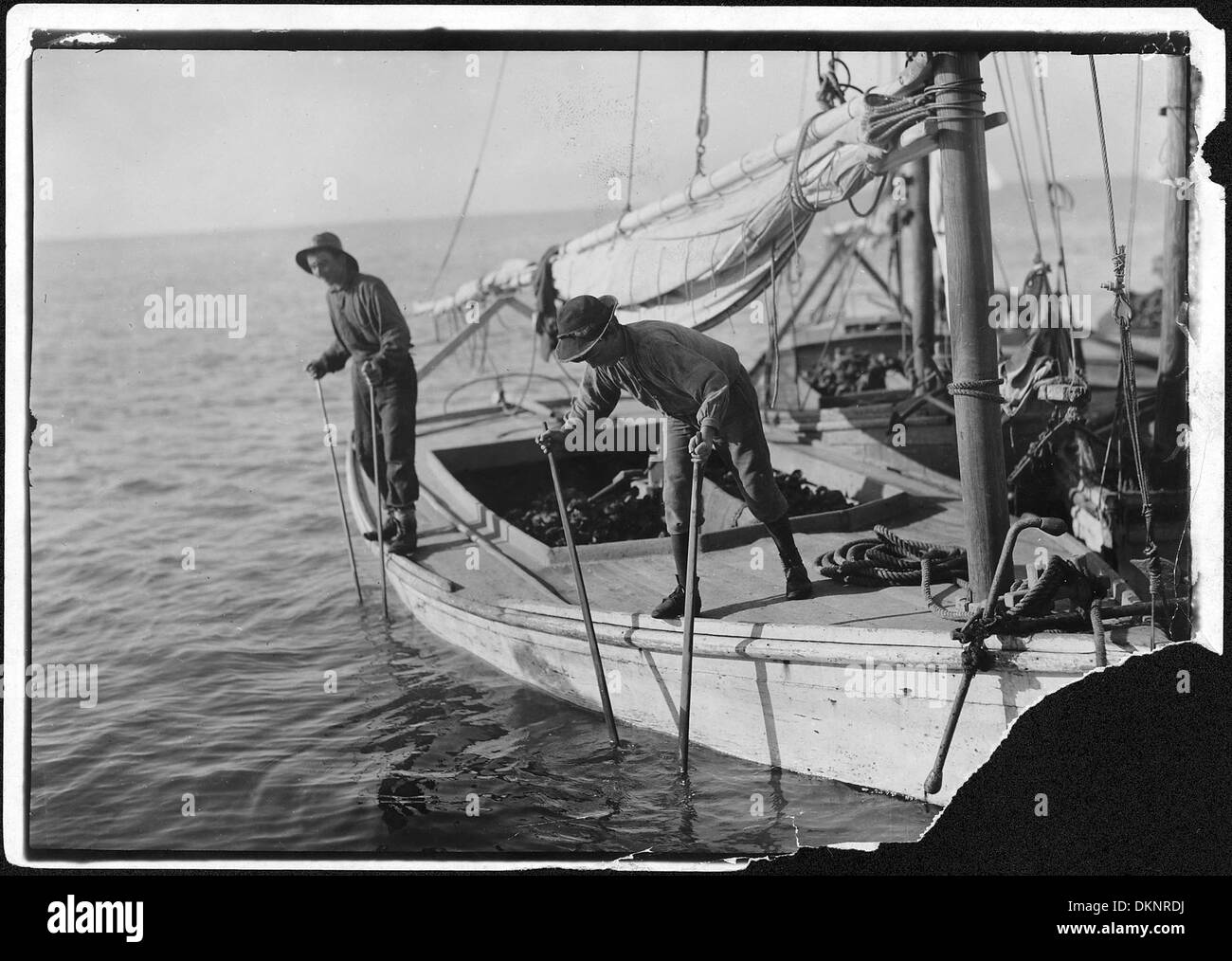 Two boys on boat Black and White Stock Photos & Images - Alamy