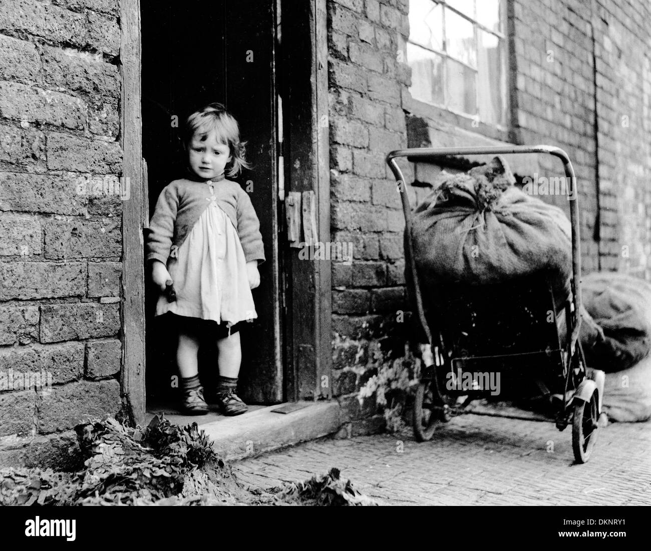 Young girl on door step of house in Flood Street area of Dudley in West Midlands Uk 1954 Stock Photo