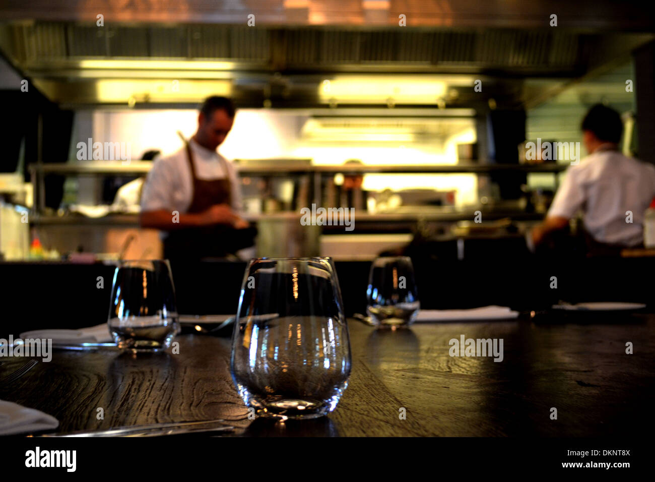 chef in open kitchen in casual dining restaurant Stock Photo - Alamy