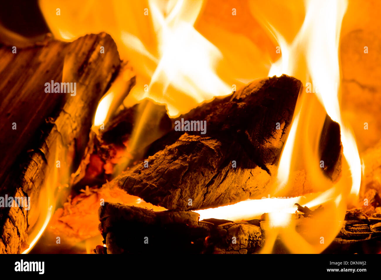 A close up of logs burning on an open fire Stock Photo