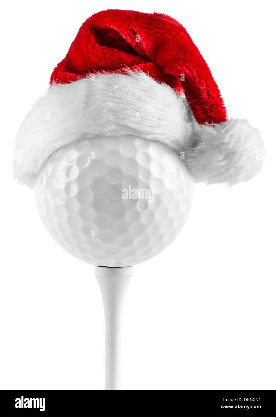 golf ball on tee with santa hat Stock Photo