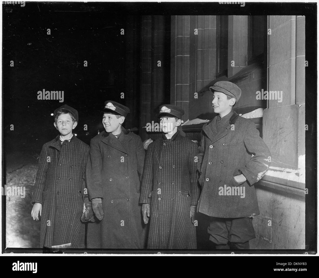 Western Union Messengers on night duty, 10-30 P.M. Left to right, Joseph Strassburg (had just gotten off), Leo... 523279 Stock Photo