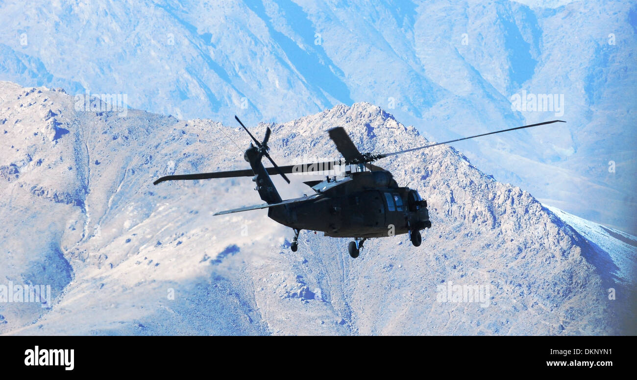 A UH-60M Black Hawk helicopter from C Company 'War Lords', 2nd Battalion (Assault), 10th Combat Aviation Brigade, Task Force Knighthawk, flies a personnel movement mission Dec. 4, over Logar province, Afghanistan. Stock Photo