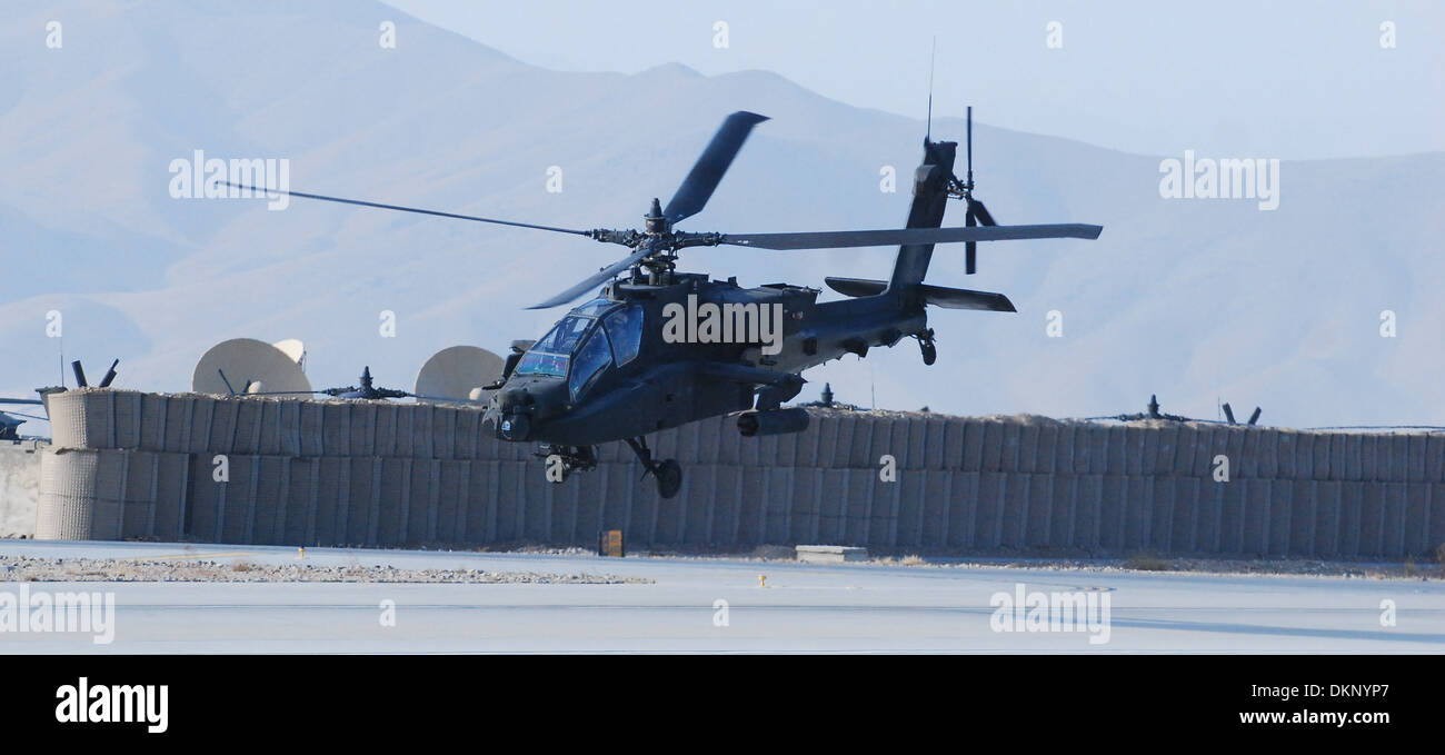An AH-64 Apache helicopter from 2nd Battalion (Assault), 10th Combat Aviation Brigade, Task Force Knighthawk, departs Forward Operating Base Shank, Afghanistan, Dec. 4, to conduct a security and reconnaissance mission over Logar Province. Stock Photo
