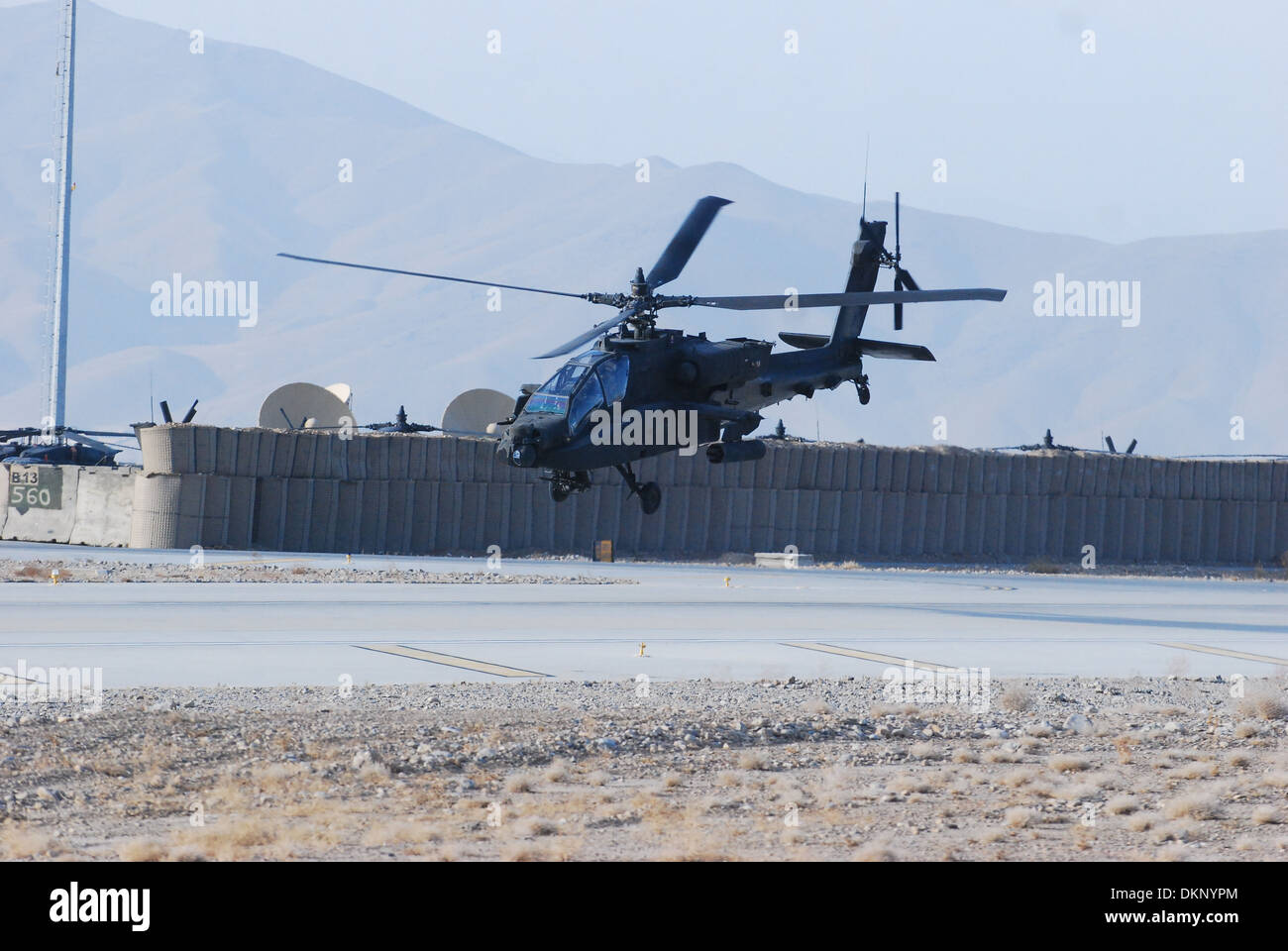 An AH-64 Apache helicopter from 2nd Battalion (Assault), 10th Combat Aviation Brigade, Task Force Knighthawk, departs Forward Operating Base Shank, Afghanistan, Dec. 4, to conduct a security and reconnaissance mission over Logar Province. Stock Photo