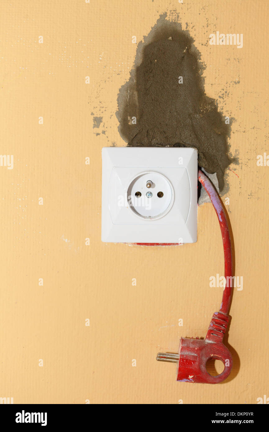Outlet cord and plug. Electric socket in construction site Stock Photo