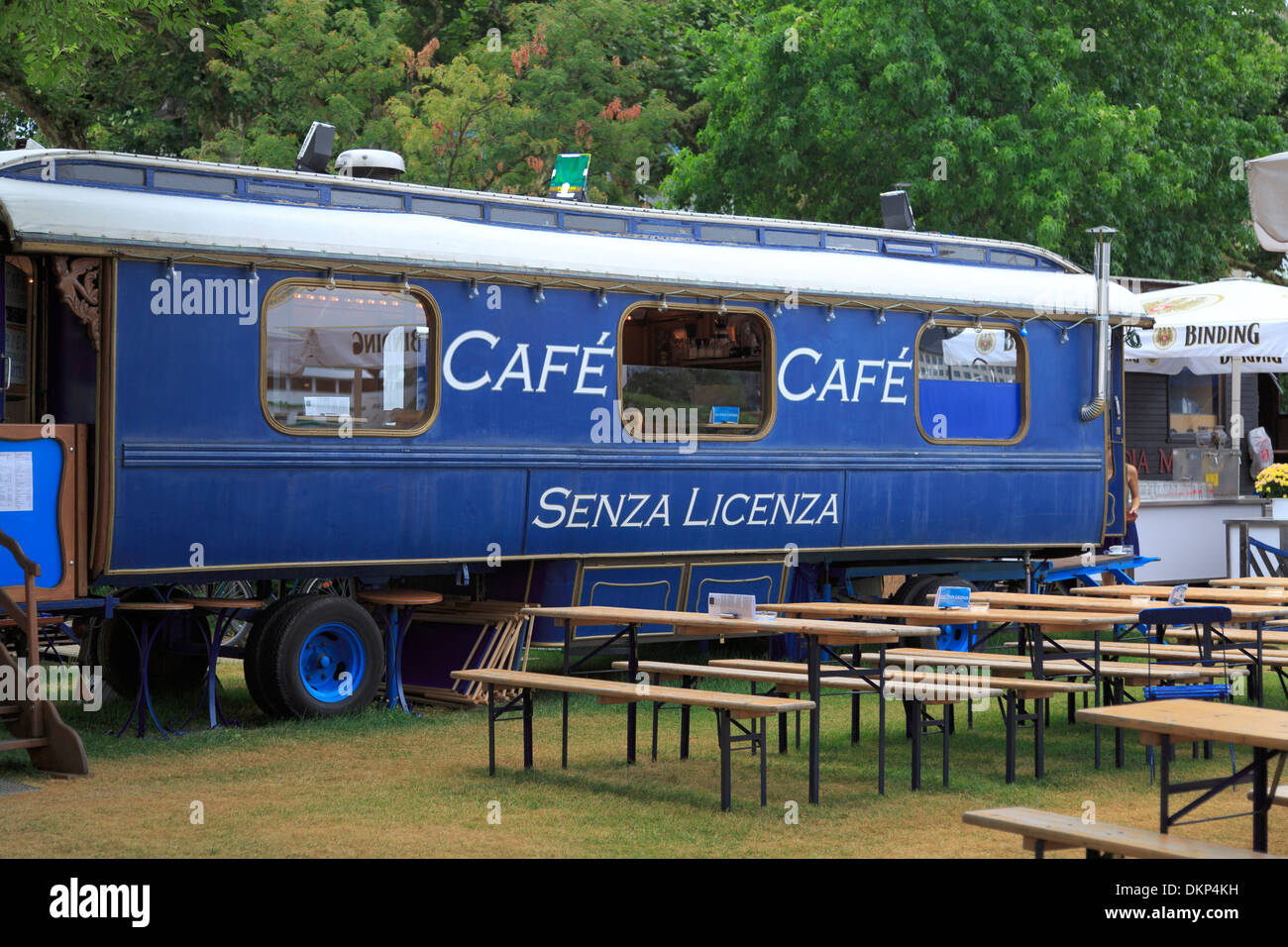 Rail carriage converted into a restaurant and parked in a garden with benches, Frankfurt, Germany Stock Photo