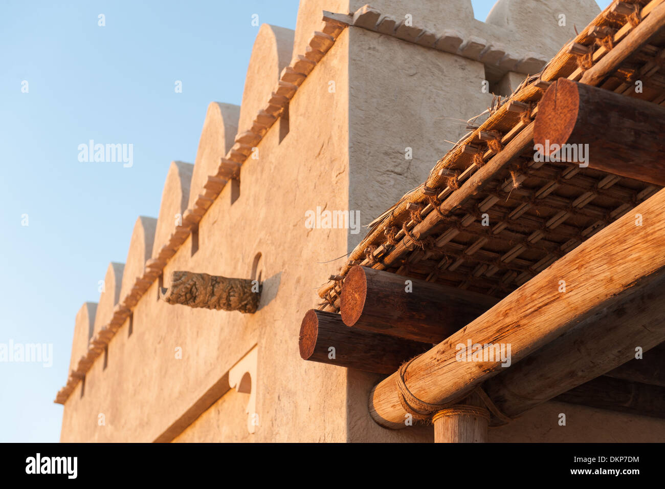 Traditional Arab architecture built using natural materials (adobe style, wood, reeds) at sunset, Abu Dhabi, UAE Stock Photo