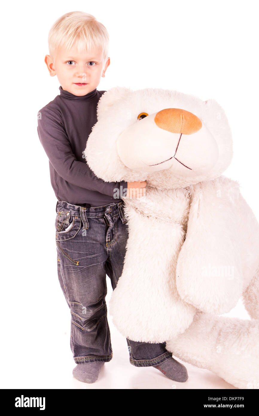 Cute little boy standing with big white bear isolated on white Stock ...