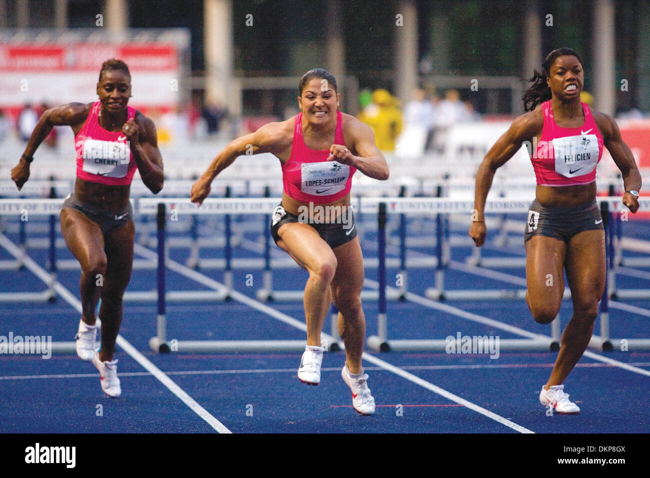 June 11, 2009 - Toronto, Ontario, Canada - 11 June 2009:  Priscilla Lopes-Schleip of Canada (center), edged out fellow teammate Perdita Felicien (right) in the Women's 100 Meter Hurdles at University of Toronto's Festival of Excellence. Lopes-Schleip completed her sprint at a time of 12.86 -  beating Felicien  by a margin of 2 one-hundredths of a second. (Credit Image: © Southcreek Stock Photo