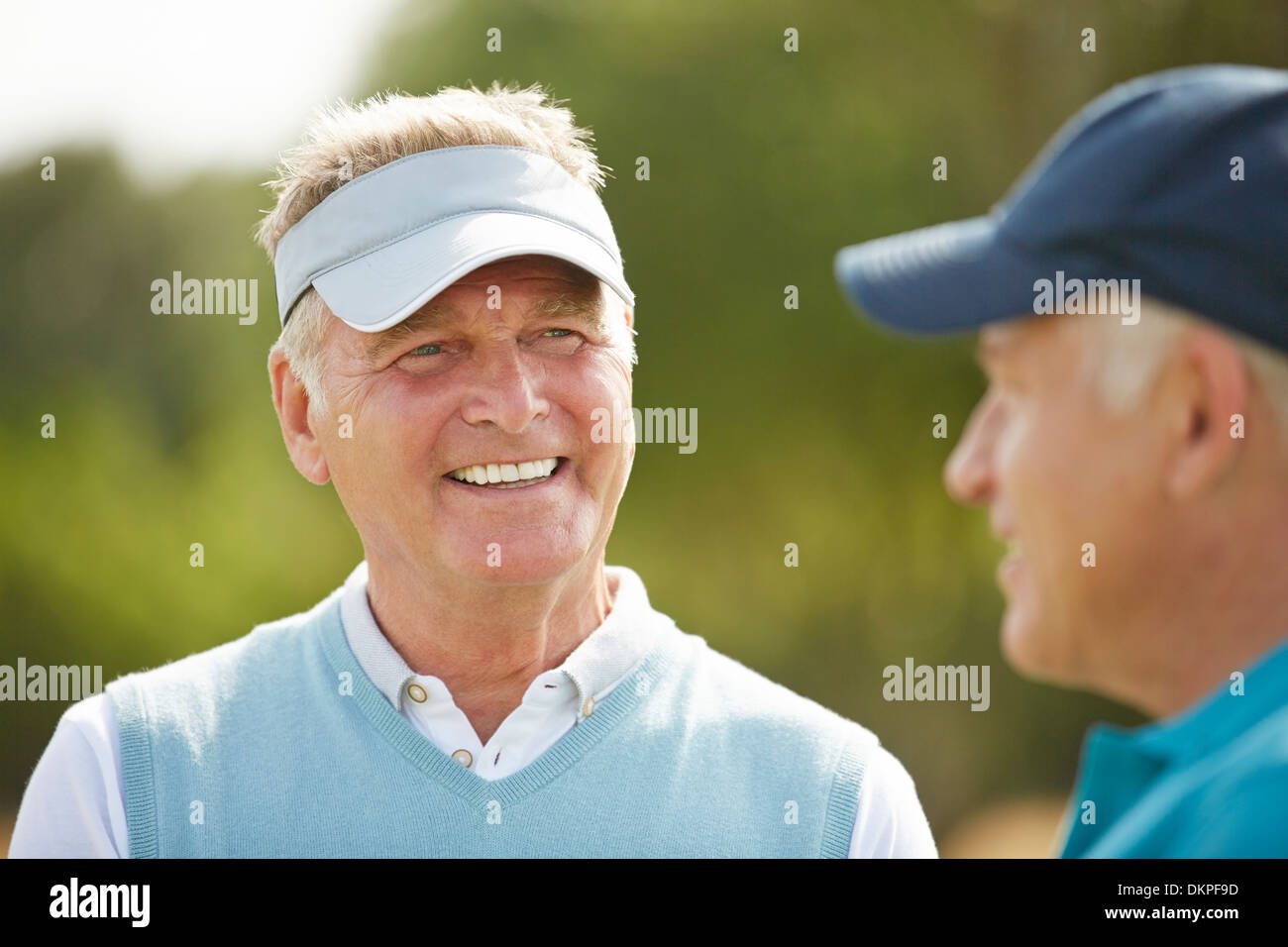Senior golfers talking Stock Photo