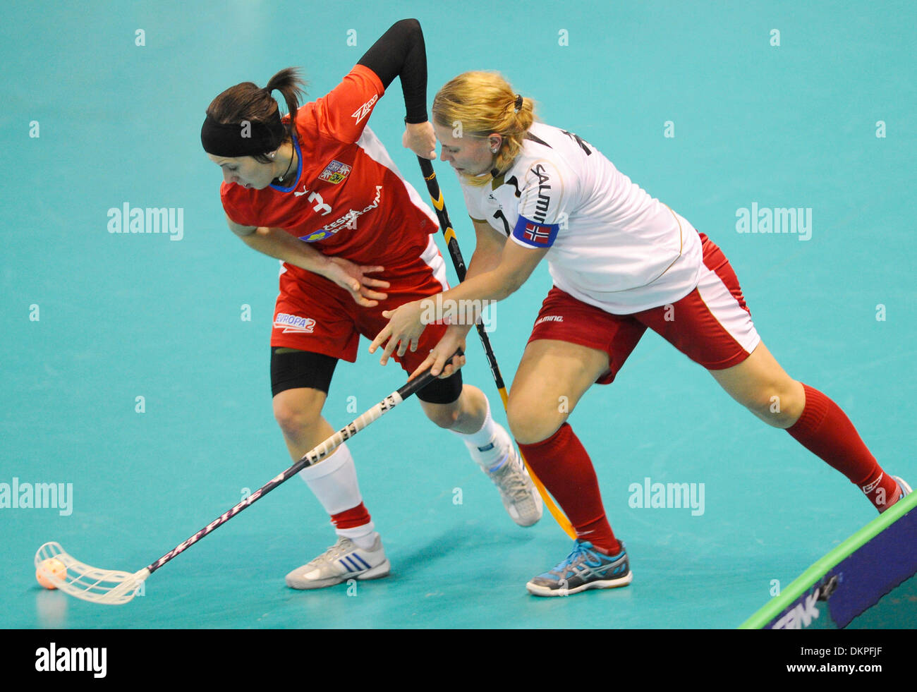 Brno, Czech Republic. 7th Dec, 2013. Norway's player Anette Berg, right, and Gabriela Zurkova of Czech Republic fight for the ball during the Women's World Floorball Championships B group match played in Brno, Czech Republic, December 7, 2013. © Vaclav Salek/CTK Photo/Alamy Live News Stock Photo