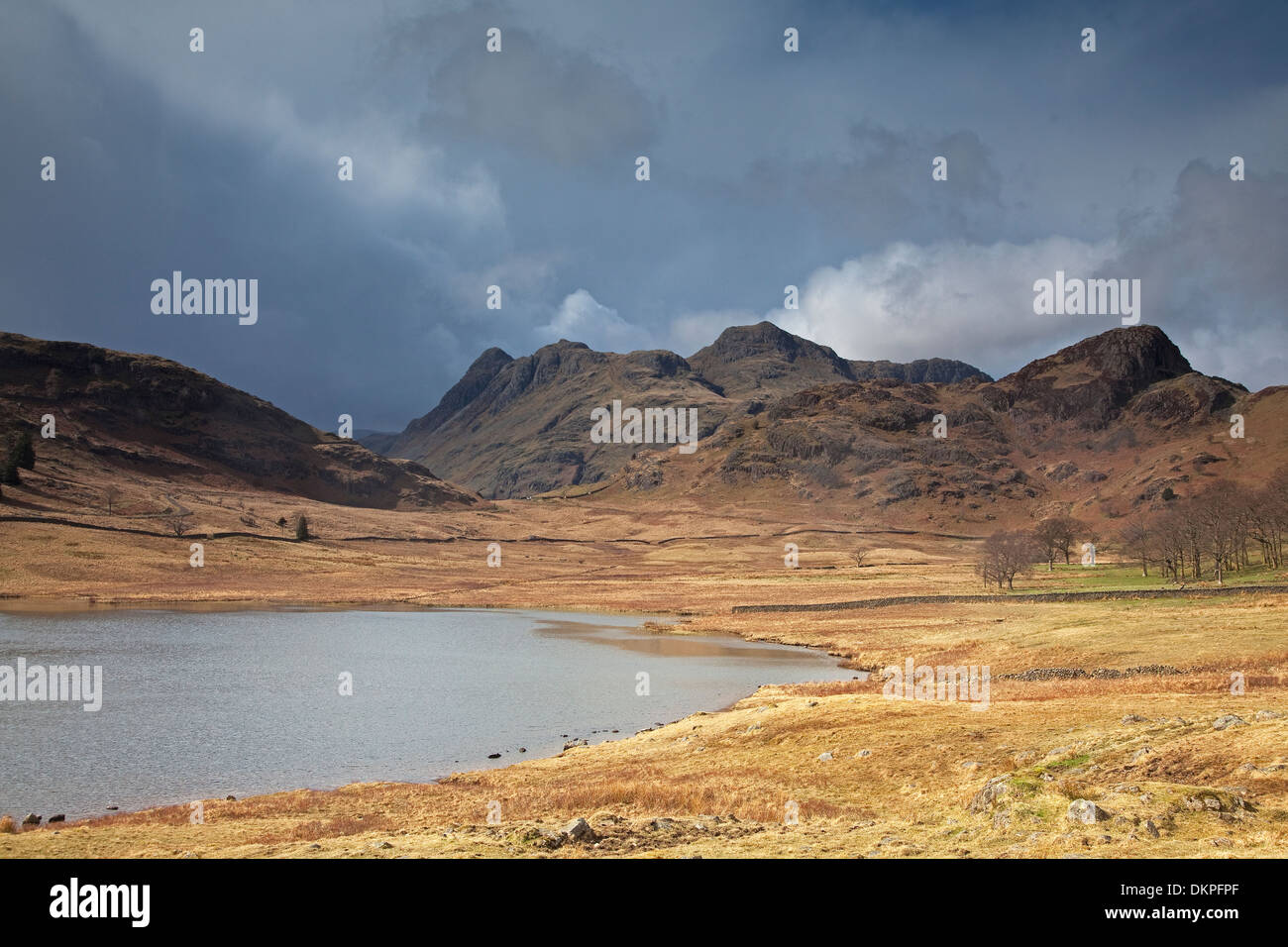 Craggy hills beyond lake Stock Photo