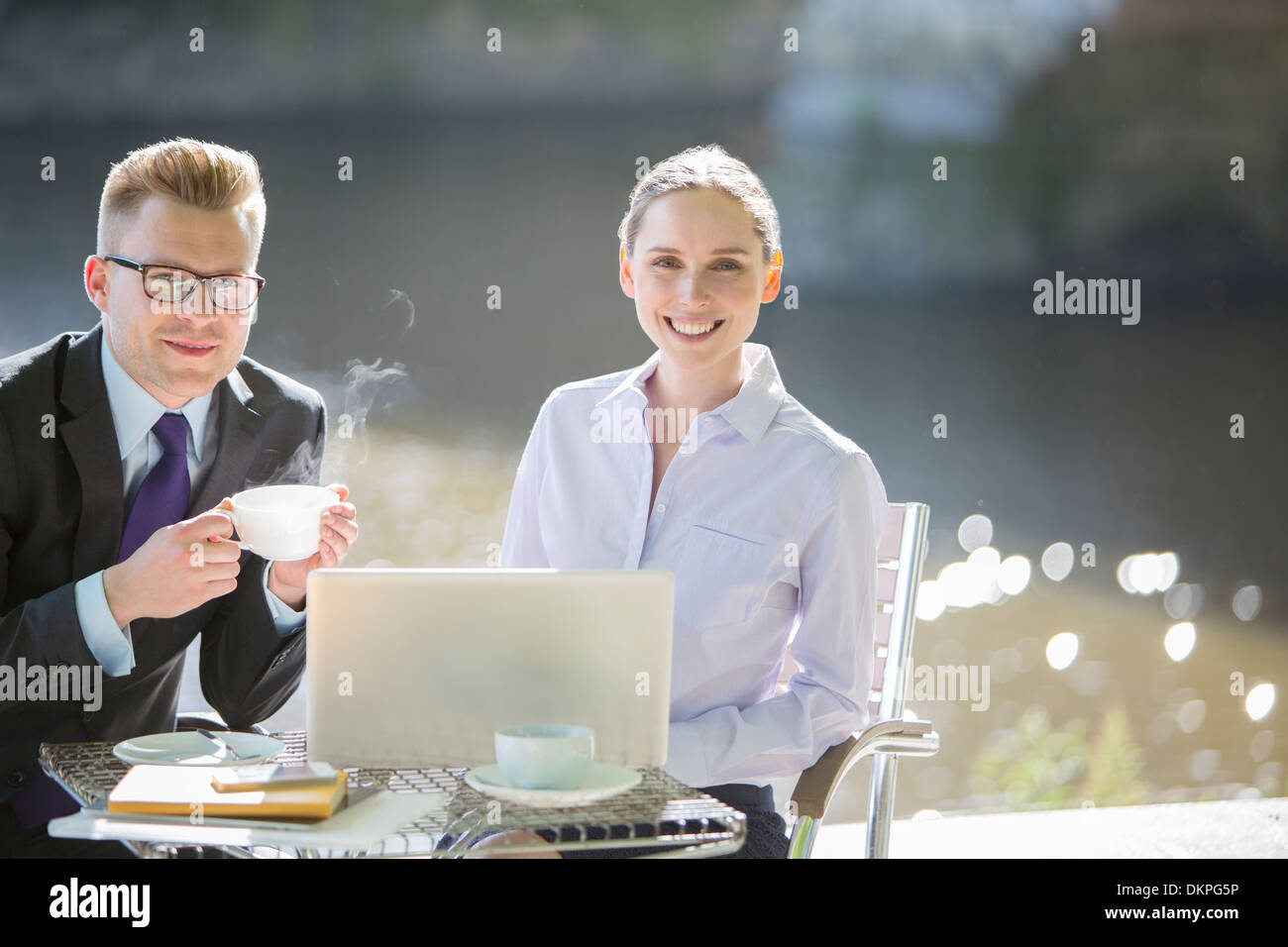 Business people working at sidewalk cafe Stock Photo