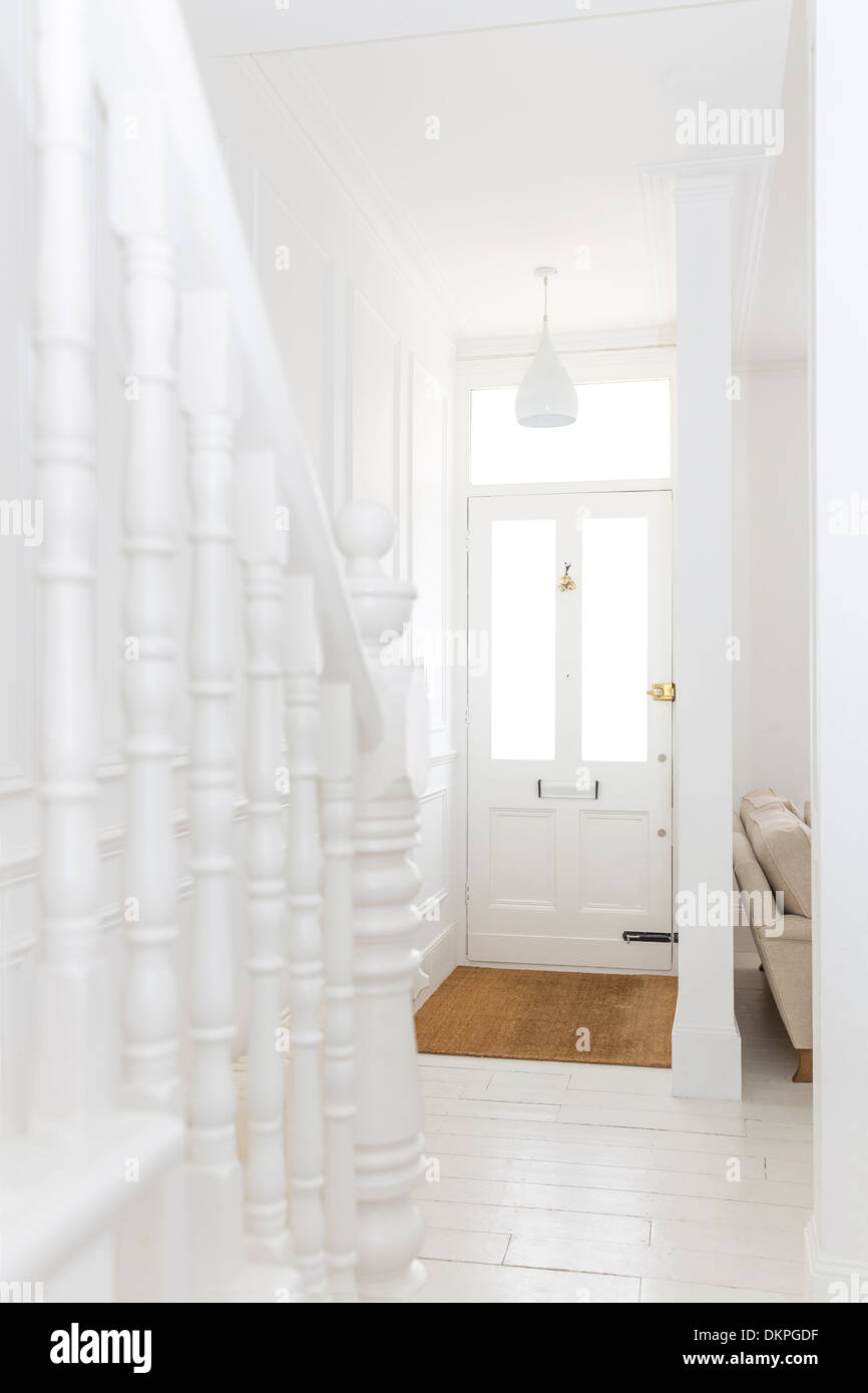 Staircase in white foyer Stock Photo