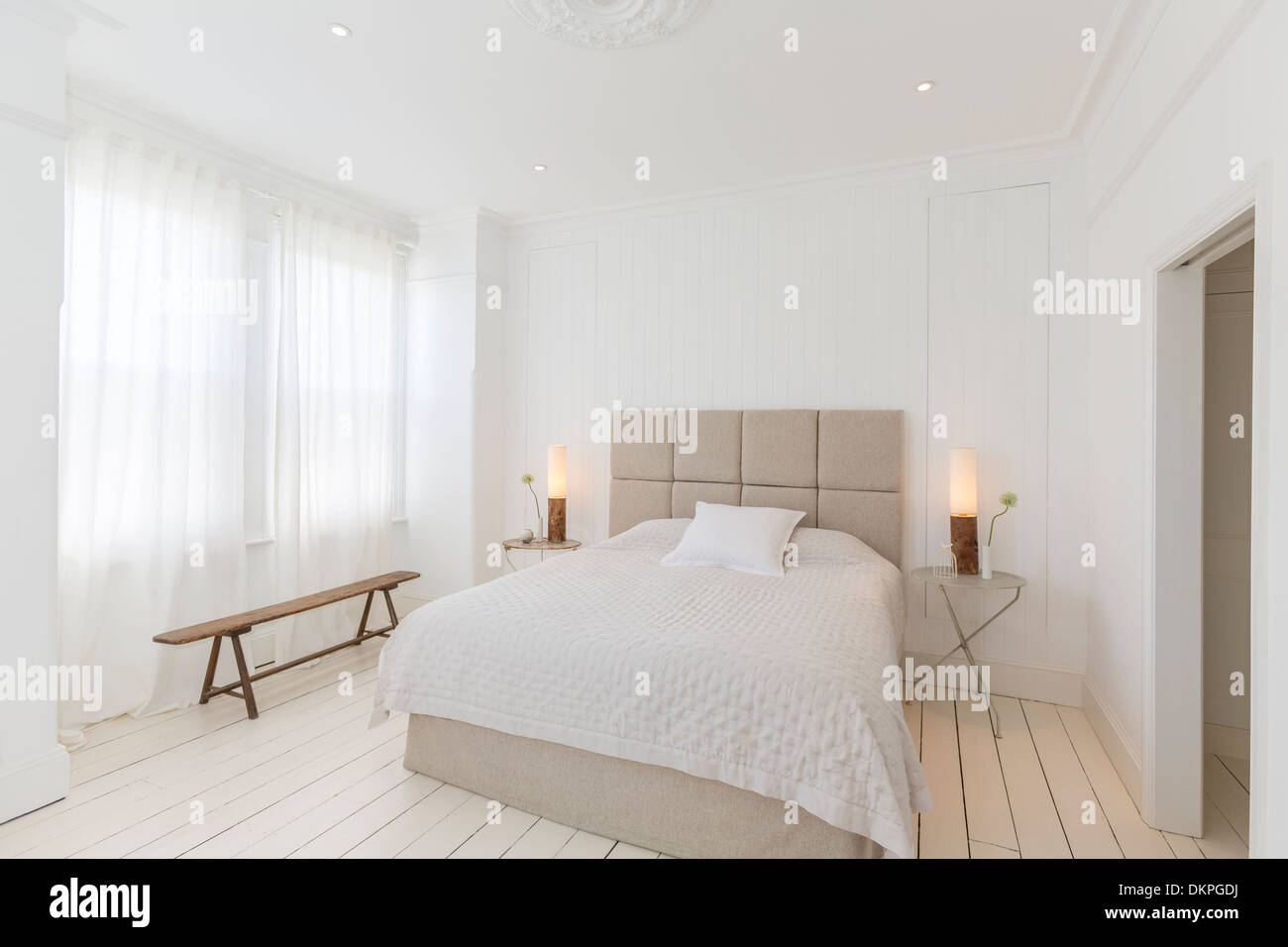 Bed and tables in modern bedroom Stock Photo
