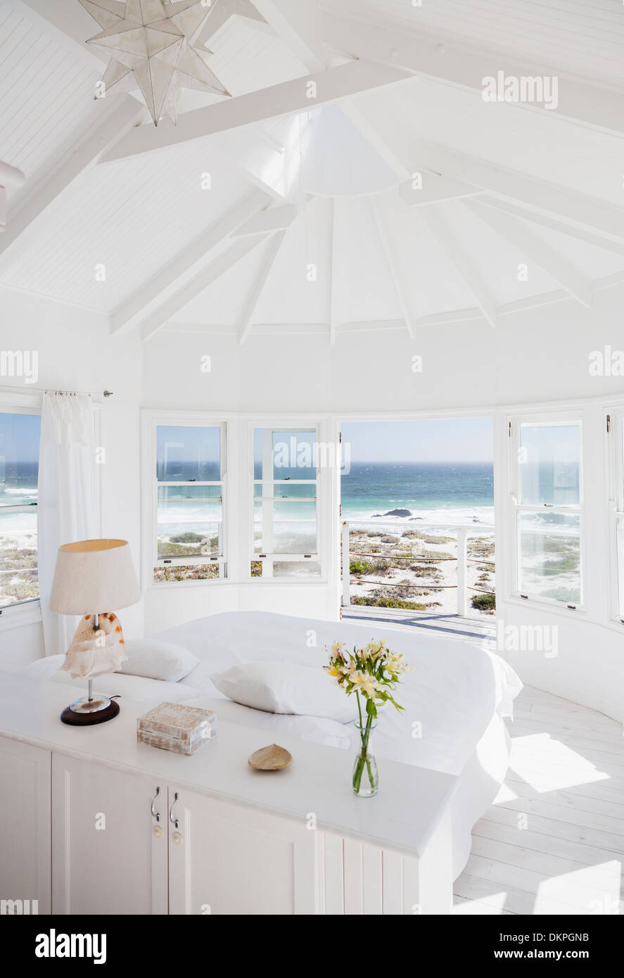 Bedroom overlooking ocean Stock Photo