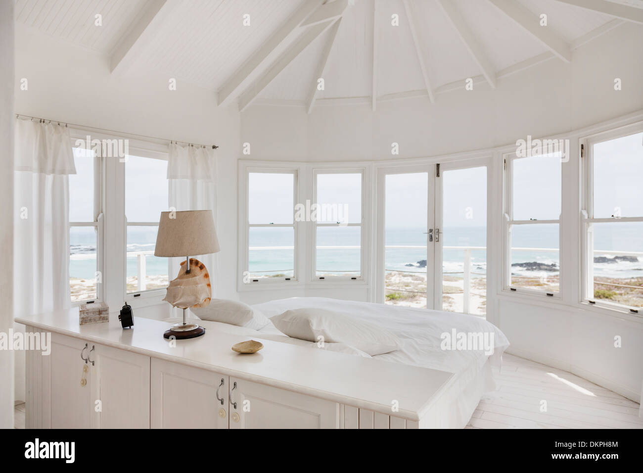 White bedroom overlooking ocean Stock Photo Alamy