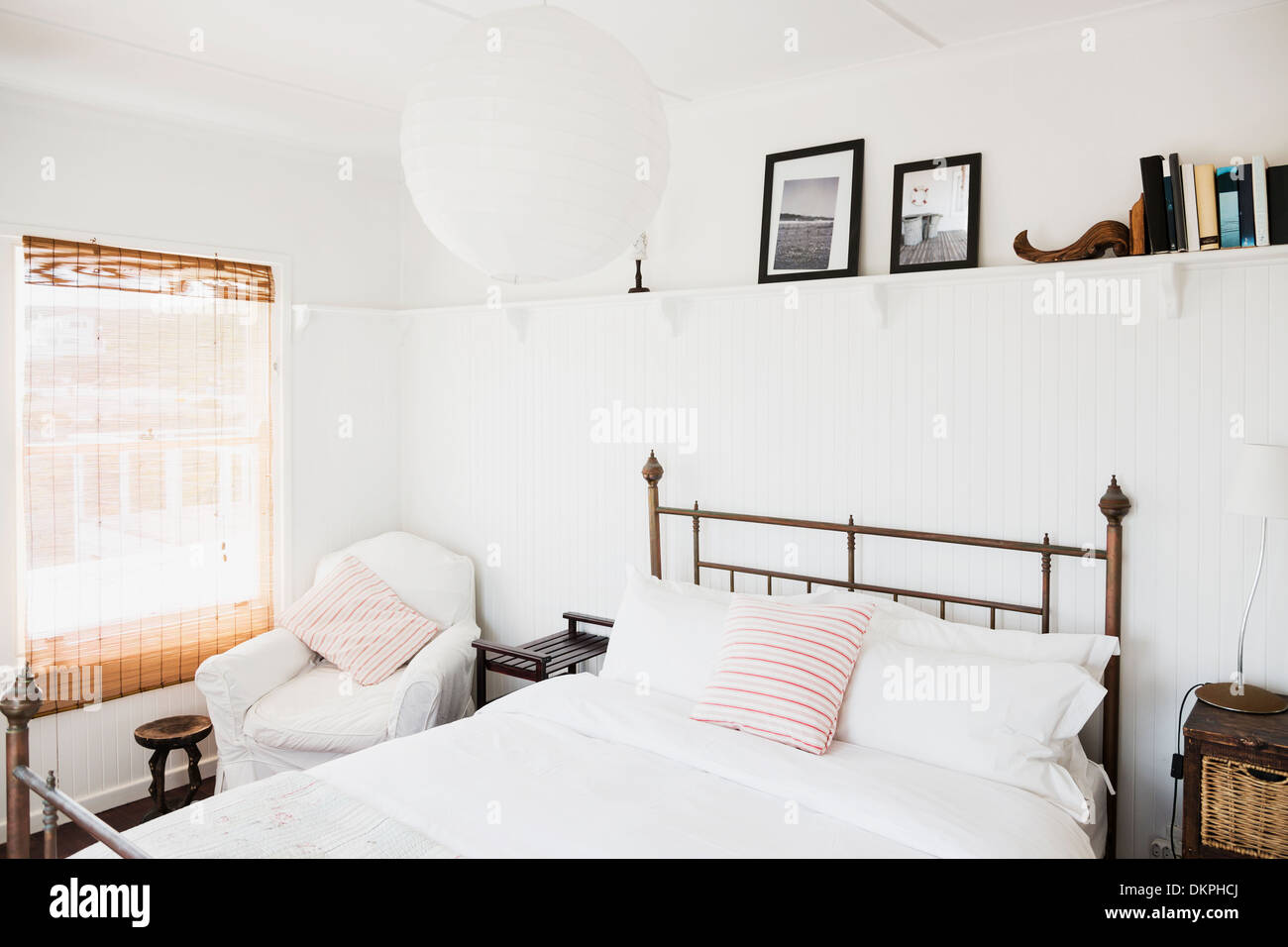 Shelf above bed in white bedroom Stock Photo: 63806194 - Alamy