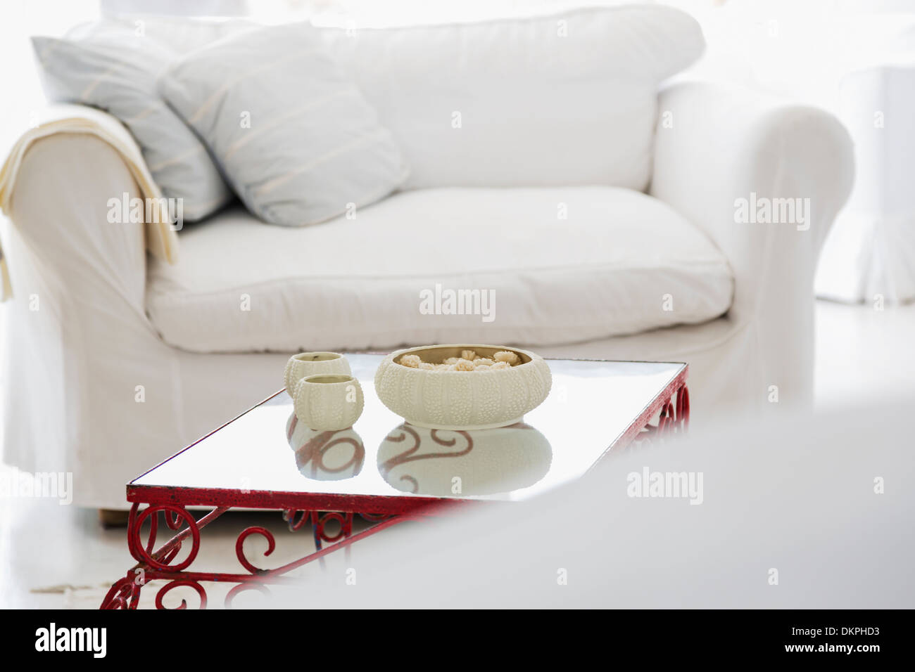 Candles on coffee table in living room Stock Photo