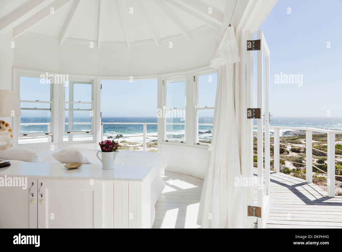White bedroom overlooking ocean Stock Photo Alamy