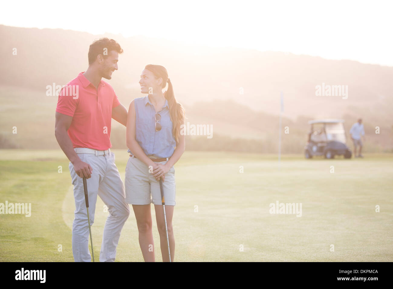 Couple on golf course Stock Photo
